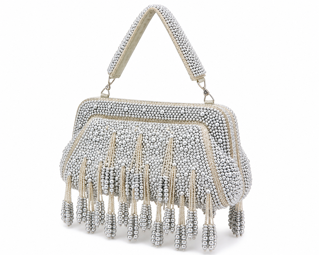 Silver beaded handbag with fringe on a white background