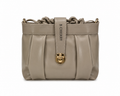 Beige handbag with gold lock and 'B Cherry' strap on a white background