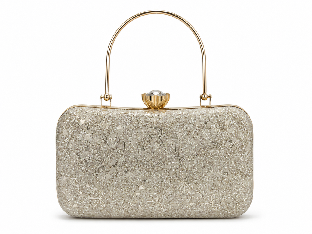 Silver clutch bag with floral patterns and a gold handle on a white background
