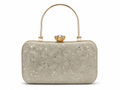 Silver clutch bag with floral patterns and a gold handle on a white background
