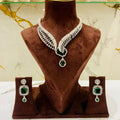 Jewelry set with necklace and earrings on a brown mannequin bust.