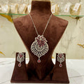 Jewelry set with a necklace and earrings on a brown mannequin bust.