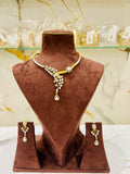 Jewelry set on a brown velvet mannequin with a marble background