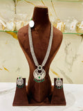 Jewelry set with necklace and earrings on a brown mannequin against a marble background