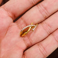 Gold ring with diamonds on a hand