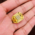 Gold ring with embedded diamonds on a hand