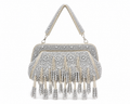 Silver beaded handbag with fringe on a white background
